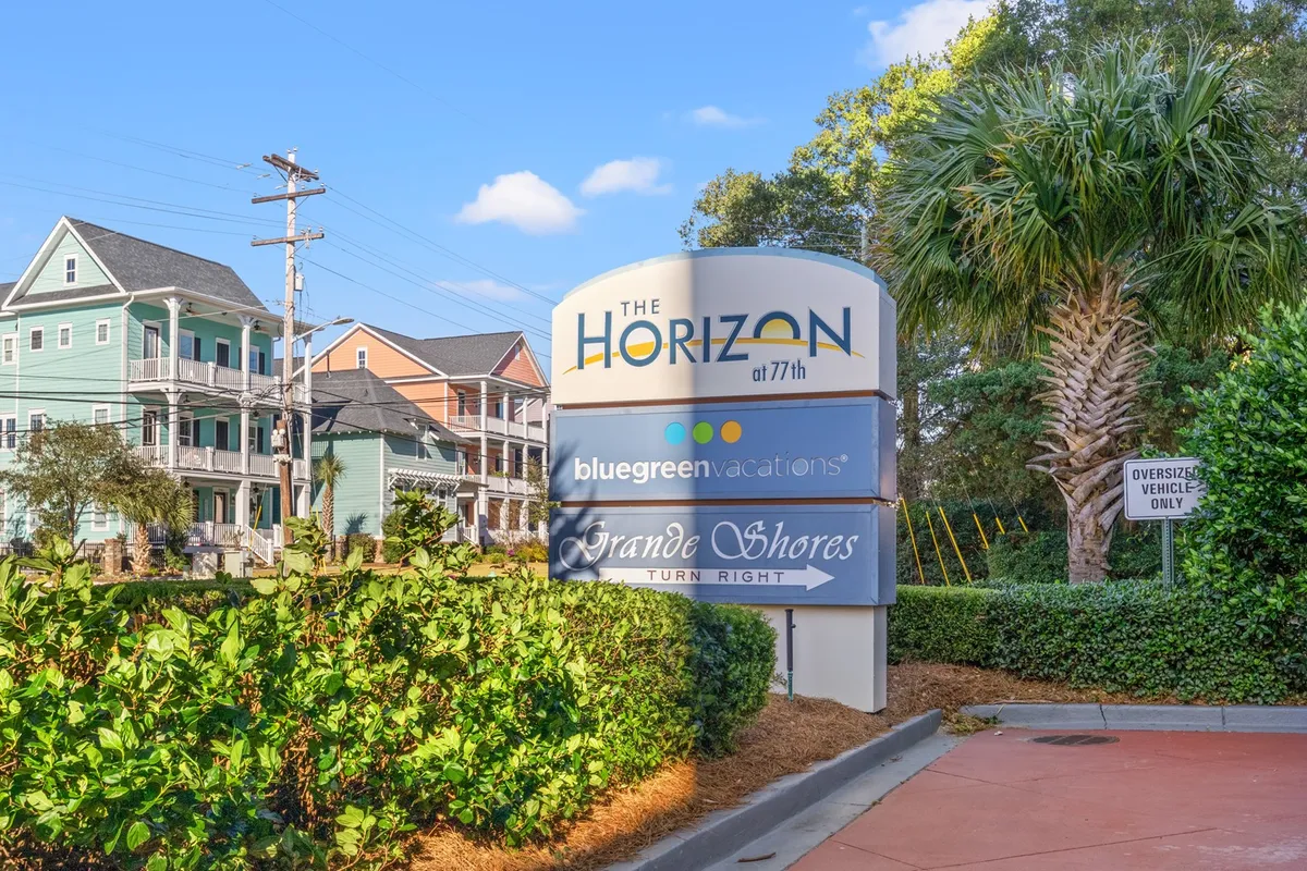 The exterior view of Horizon Resorts showcases the property’s colorful buildings, palm trees, and welcoming signage. The vibrant scene suggests proximity to the beach and an inviting vacation atmosphere.